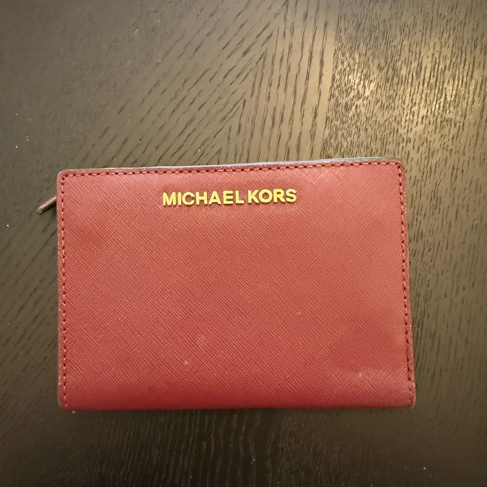 MICHAEL MICHAEL KORS Bryant Medium Pebbled Leather Wallet in a rich oxblood red